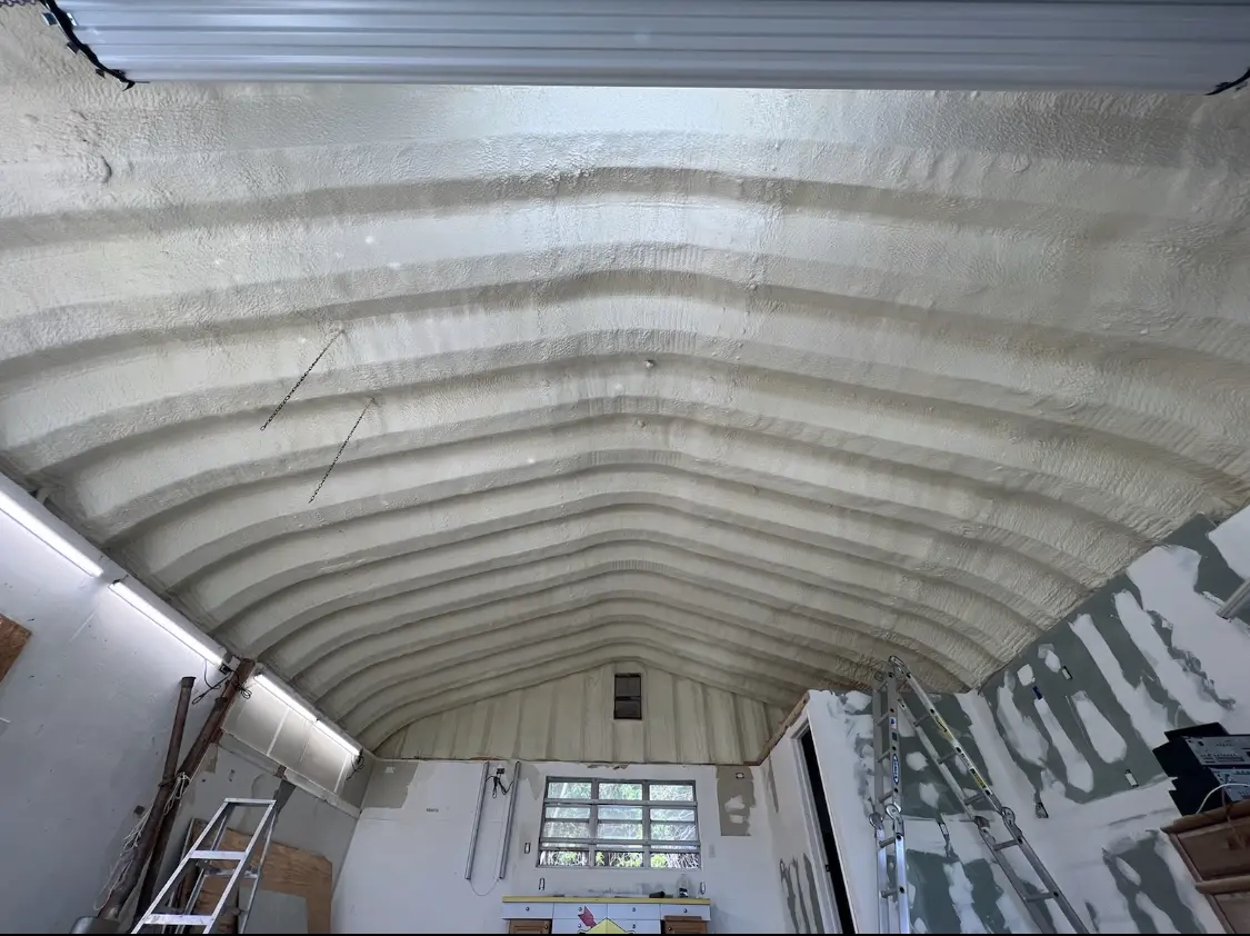Spray polyurethane foam applied to the underside of a metal roof deck in Batesville